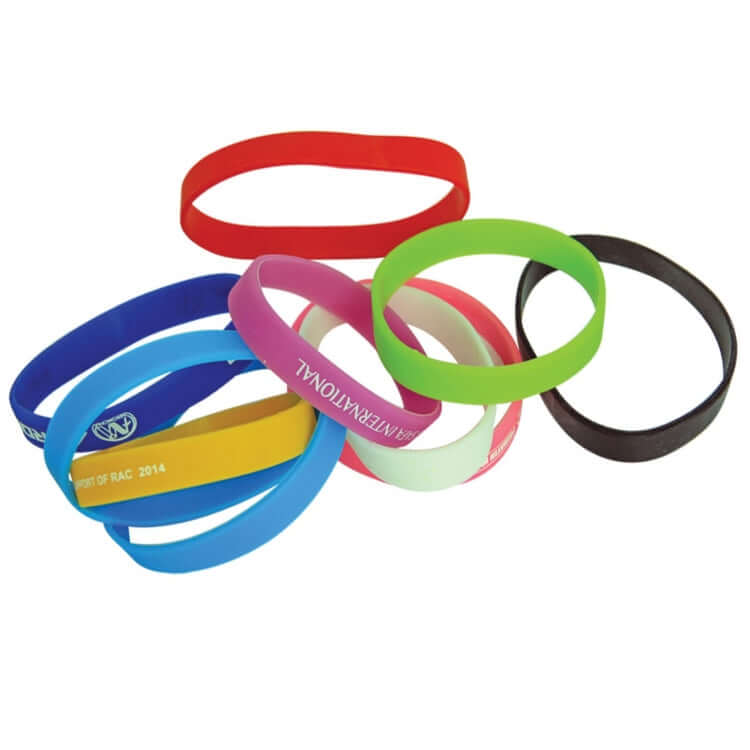 Assorted 1.5cm width silicone wristbands in bright colors for branding and awareness, durable and comfortable.