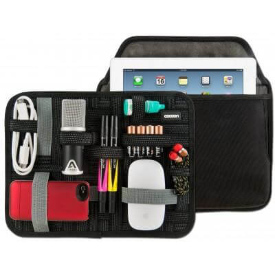 Black Cocoon GRID-IT elastic organiser panel and case shown with example cables, gadgets and a tablet