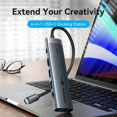 Vention 6-in-1 USB-C Docking Station with HD Display connected to a laptop.