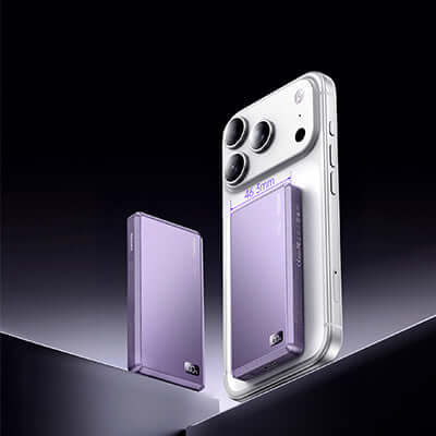 Remax FP-36 Magnetic Suction Wireless Charging Powerbank 5000mAh next to a smartphone for size comparison.