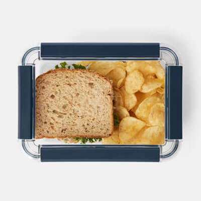 Yeti Large Plastic Food Storage Box with sandwich and chips, perfect for outdoor meals and corporate gifts.