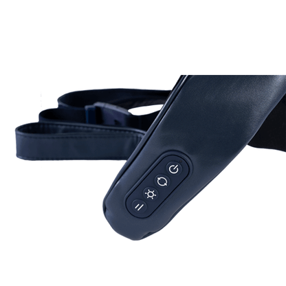 Close-up of OTO Q Hug massager control panel with buttons for heat and massage settings.