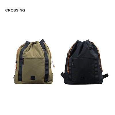 Crossing Jack Drawstring Totepack in olive green and black with paracord detailing and versatile carry options.