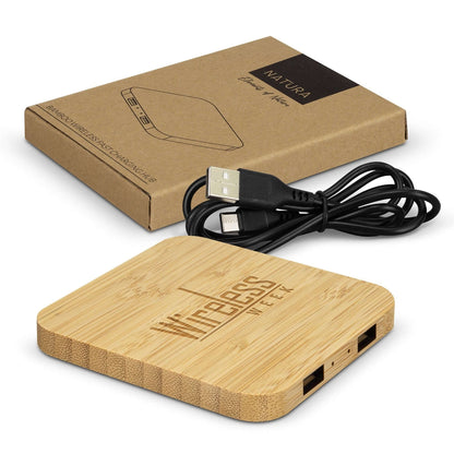 NATURA bamboo wireless charging hub with illustrative engraved artwork, black USB cable and branded kraft gift box