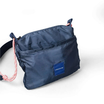 Crossing Kai Crossbody Bag in navy with adjustable paracord strap and exterior pockets, ideal as a Corporate Gift.