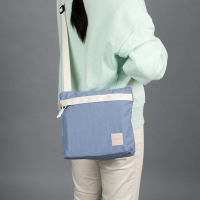 Crossing Remi Crossbody Bag worn by a person, showcasing style and functionality, ideal as a corporate gift.