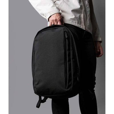 Person holding the ALPAKA Metro Backpack Pro in black for modern professionals, ideal as a corporate gift.