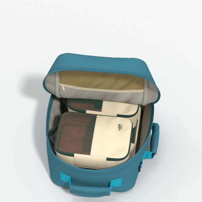 Cabinzero Classic Backpack 28L interior showing organized storage compartments and zippered pocket.