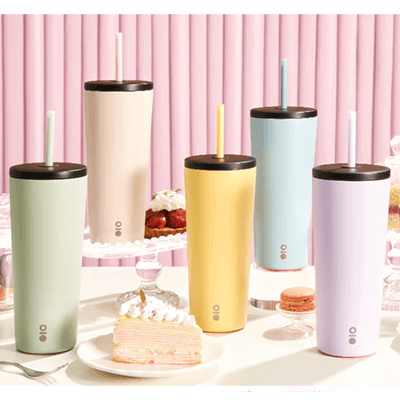 Montigo Wonderama Sense Straw 650ml tumblers in pastel colors on a dessert table, perfect for hydration.