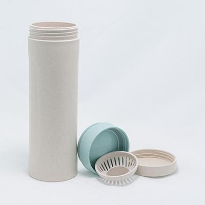 Opened speckled wheat straw bottle with separate blue cap, inner cover and slotted strainer-style insert