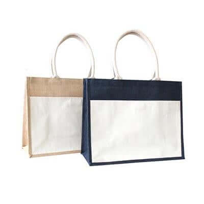 Natural-toned and dark jute totes with contrasting cream canvas front pockets and cream carry handles
