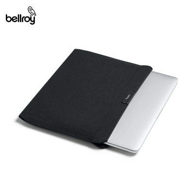 Black Bellroy Laptop Sleeve shown with a laptop partially inserted into the opening