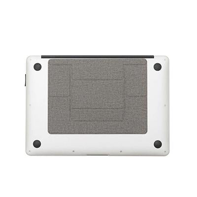 Grey laptop stand folded flat against the underside of a silver laptop