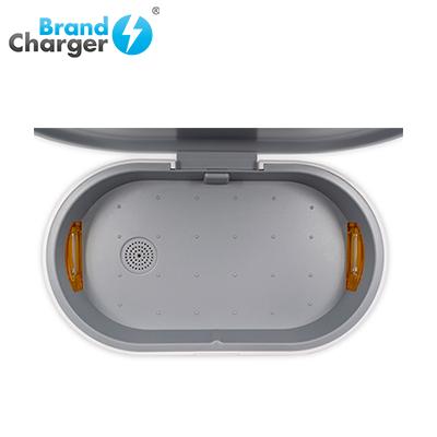Top view into the empty BrandCharger unit with its lid open and chamber visible