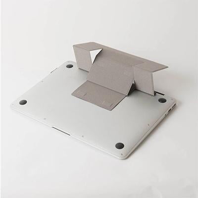 Laptop underside showing the grey stand panel unfolded into its support shape