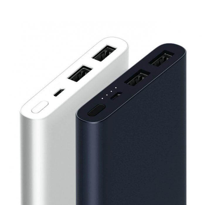 Xiaomi power bank port close-up showing two USB-A ports, a smaller charging port, indicator lights and a button
