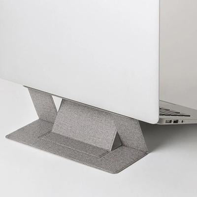 Grey folding laptop stand supporting a silver laptop in a raised position, viewed from behind