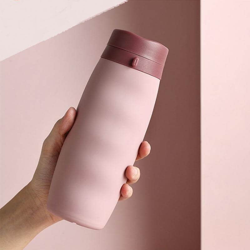 BPA Free Foldable Travel Bottle in hand, designed for hydration on the go, perfect for Corporate Gift Singapore.