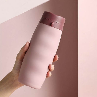 BPA Free Foldable Travel Bottle in hand, designed for hydration on the go, perfect for Corporate Gift Singapore.