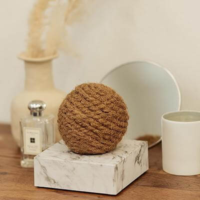Zero2.5 Natural Fiber-based Negative Ionizer Air Marble CF4000 displayed on a marble base with decorative items.