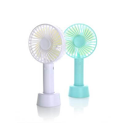 Pale and mint-green rechargeable handheld fans resting in matching desk stands