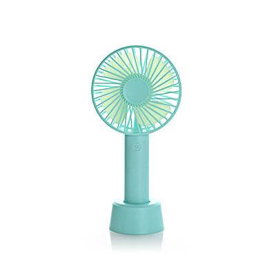 Mint-green portable fan with round front guard and matching tabletop base