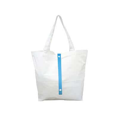 Natural-coloured canvas tote bag with long handles and a blue vertical fastening strap