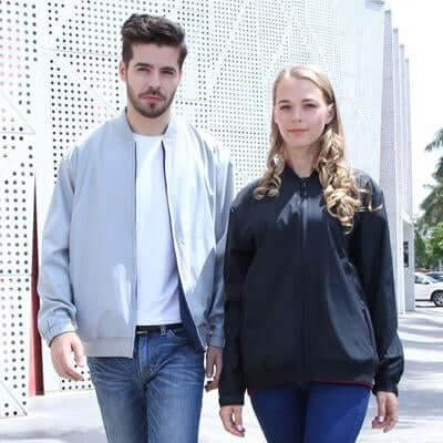 Grey and black faces of the two-tone bomber jackets worn by two models