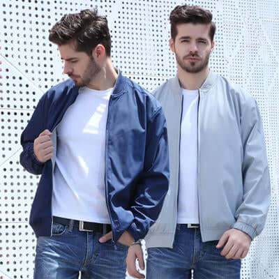Navy and grey bomber jacket views on a model showing contrasting two-tone construction