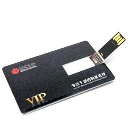 Dark printed card-shaped USB drive with the connector extended from its central cut-out